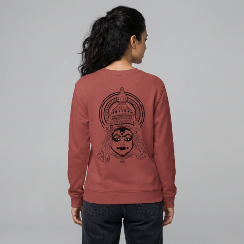 “the divine mask” – kathakali line art sweatshirt coral